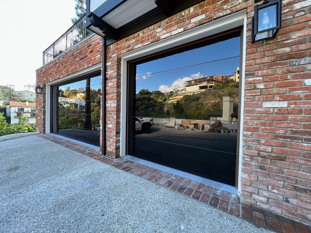 SGD Services Review v1 3 Los Angeles. One-car and two-car garage doors, full view, frameless black glass, LiftMaster jackshaft opener.