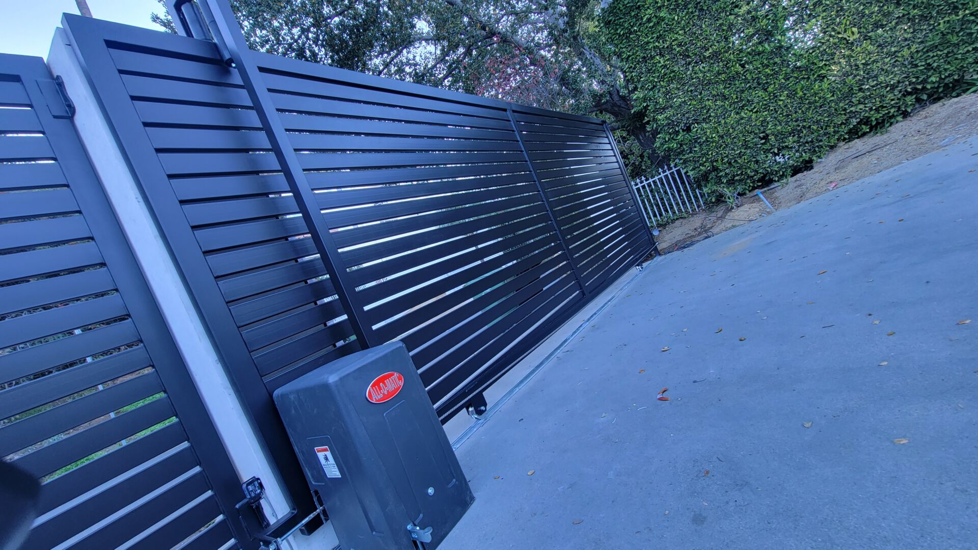 SGD Service Areas Review v2 6 Pasadena. Driveway sliding gate, horizontal slats, All-O-Matic gate motor, intercom system, columns.