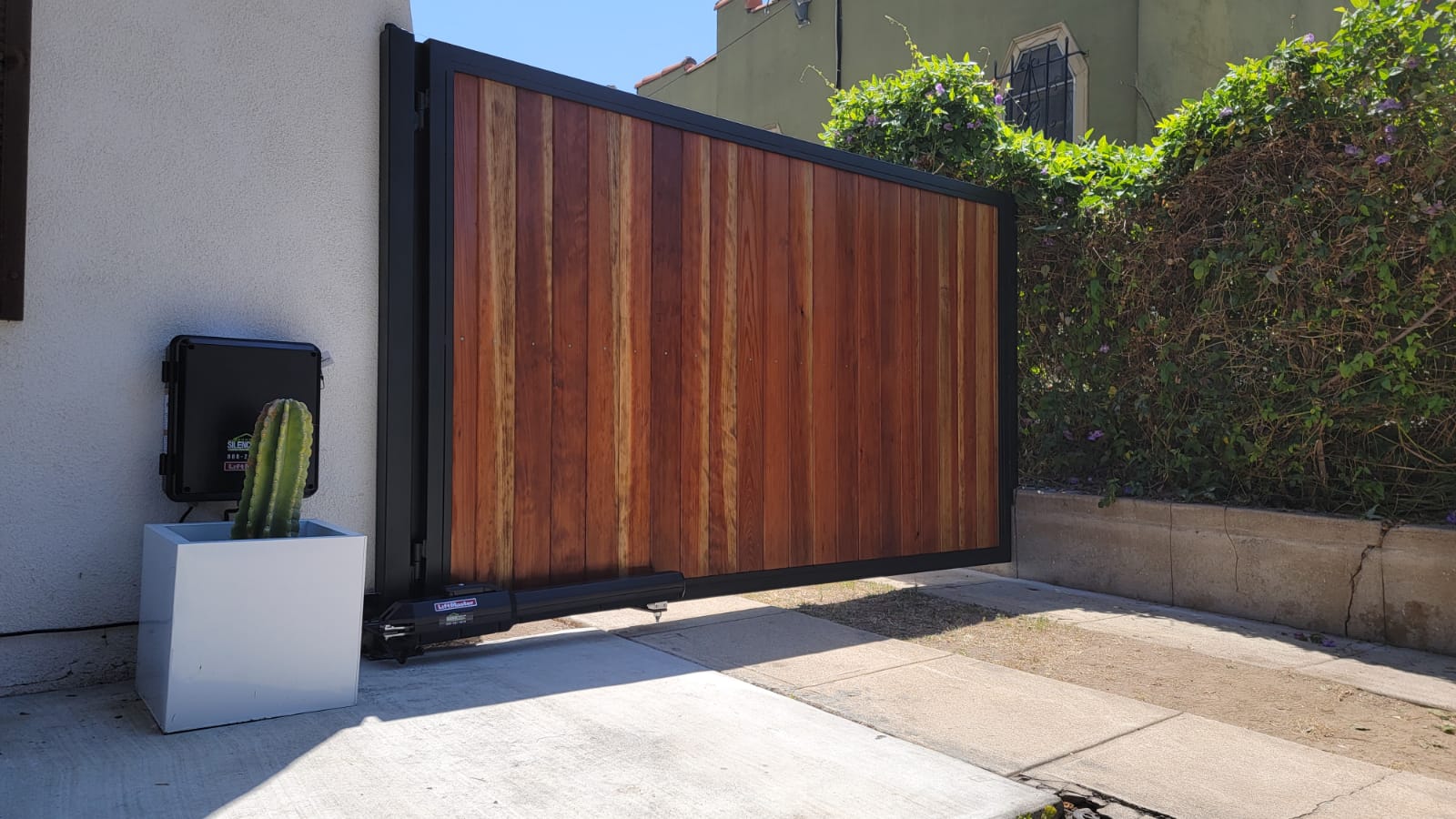 SGD Services Review v1 8 Santa Monica. Swing gate with tongue-and-groove redwood, LiftMaster LA500 gate motor.